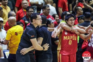 Mapua Cardinals' coach Randy Alcantara and Finals MVP Clint Escamis after winning the NCAA Season 100 men's basketball championship.