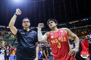 Mapua Cardinals' coach Randy Alcantara and Finals MVP Clint Escamis after winning the NCAA Season 100 men's basketball championship