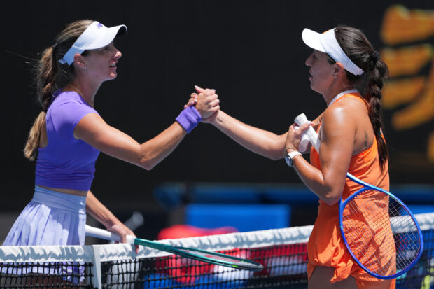 Jessica Pegula, right, of the U.S. is congratulated by compatriot McCartney Kessler, left, following their second round match at the Australian Open tennis championship in Melbourne, Australia, Thursday, Jan. 22, 2026.